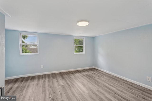 635 Elroy Rd, Souderton, PA 18964 - empty room featuring wood finished floors, plenty of natural light, and baseboards