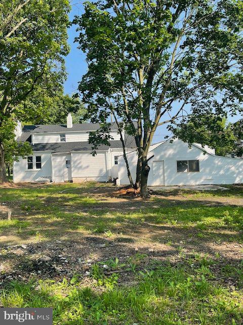 635 Elroy Rd, Souderton, PA 18964 - rear view of property featuring a chimney