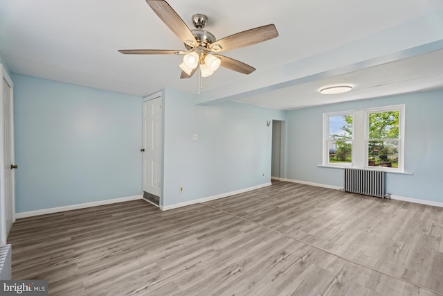 635 Elroy Rd, Souderton, PA 18964 - spare room with radiator, ceiling fan, wood finished floors, and baseboards