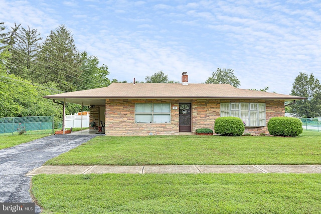 25 Kollman Dr, Newark, DE 19713 - view of front of house featuring asphalt driveway, a chimney, stone siding, and an attached carport