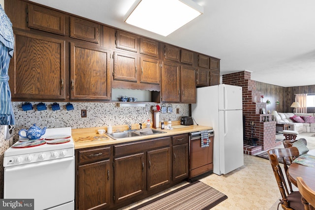 25 Kollman Dr, Newark, DE 19713 - kitchen featuring white appliances, a sink, light countertops, and dark brown cabinetry