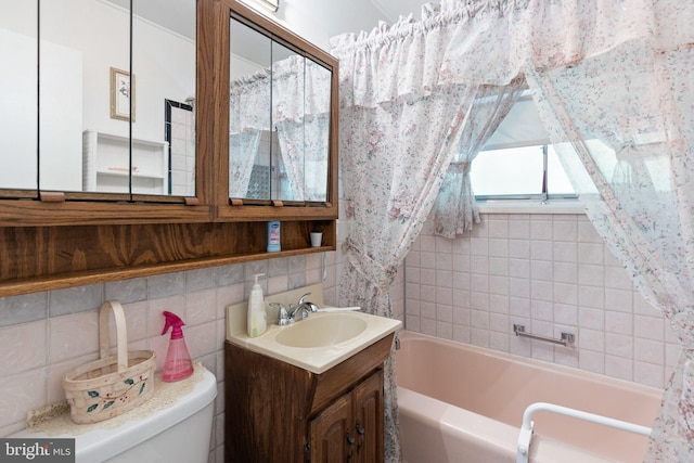 25 Kollman Dr, Newark, DE 19713 - full bathroom with a bathtub, vanity, toilet, decorative backsplash, and tile walls