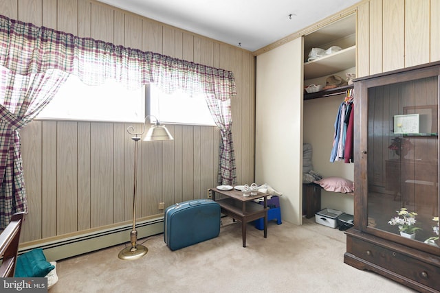 25 Kollman Dr, Newark, DE 19713 - carpeted bedroom with baseboard heating, wooden walls, and a closet