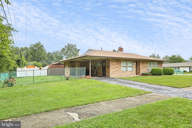 25 Kollman Dr, Newark, DE 19713 - view of front of home with asphalt driveway, a chimney, an attached carport, and stone siding