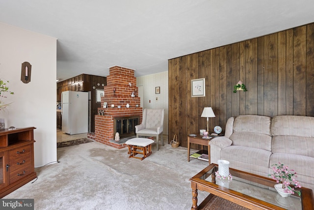 25 Kollman Dr, Newark, DE 19713 - living room featuring carpet floors, a brick fireplace, and wood walls