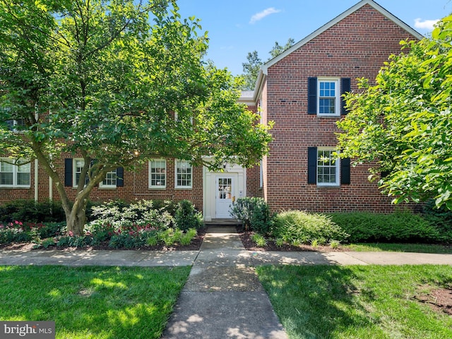 6727 W Wakefield Dr Unit A2, Alexandria, VA 22307 - view of front of home featuring brick siding and a front lawn