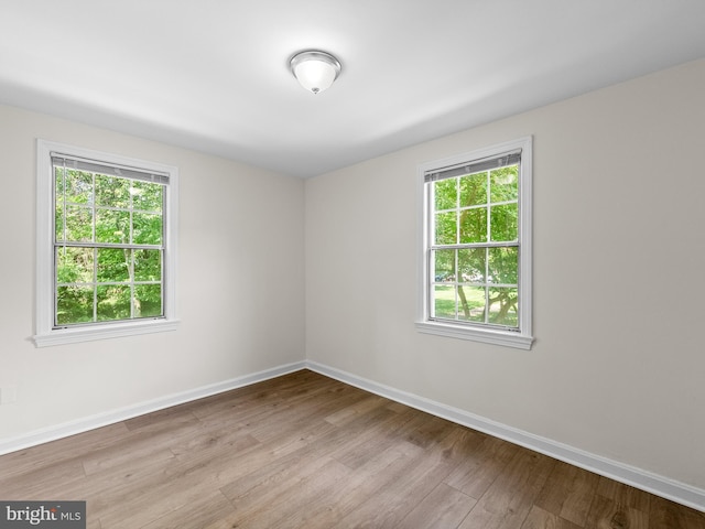 6727 W Wakefield Dr Unit A2, Alexandria, VA 22307 - spare room featuring plenty of natural light, baseboards, and wood finished floors