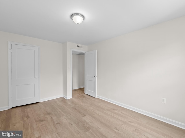 6727 W Wakefield Dr Unit A2, Alexandria, VA 22307 - unfurnished bedroom featuring light wood-style flooring and baseboards