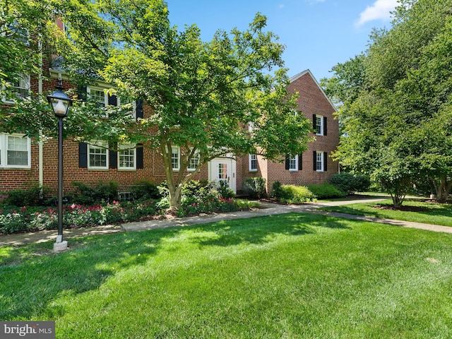 6727 W Wakefield Dr Unit A2, Alexandria, VA 22307 - view of front facade with a front yard and brick siding