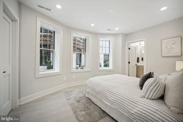1744 Lanier Pl NW Unit 1, Washington, DC 20009 - bedroom with baseboards, recessed lighting, light wood-type flooring, and connected bathroom