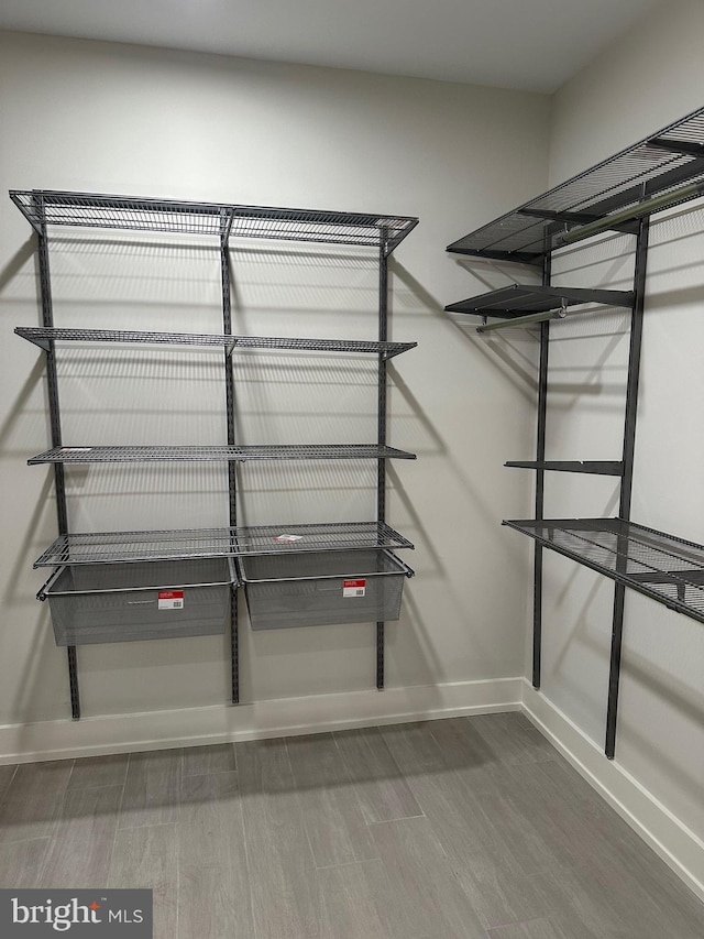 1744 Lanier Pl NW Unit 1, Washington, DC 20009 - walk in closet featuring wood finished floors