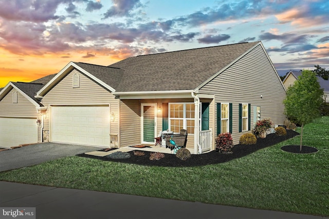 216 Jutland Way Lot 267, Red Lion, PA 17356 - view of front of home with an attached garage, a front yard, a shingled roof, and driveway
