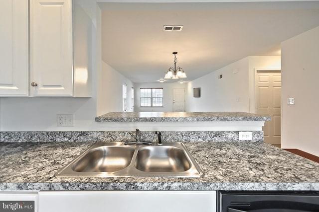 216 Jutland Way Lot 267, Red Lion, PA 17356 - kitchen with dishwasher, a chandelier, dark countertops, white cabinets, and pendant lighting