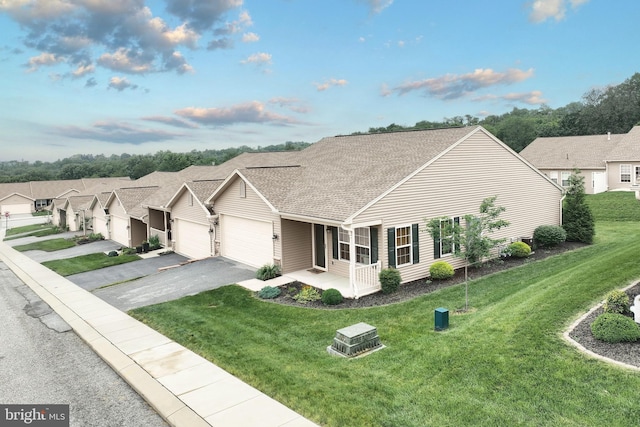 216 Jutland Way Lot 267, Red Lion, PA 17356 - view of front of home featuring an attached garage, asphalt driveway, a front lawn, a residential view, and a shingled roof