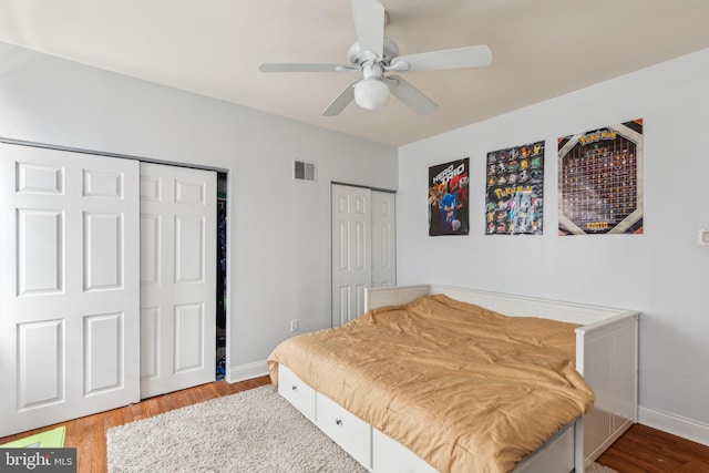 766 S 18th St, Philadelphia, PA 19146 - bedroom with multiple closets, wood finished floors, baseboards, and a ceiling fan