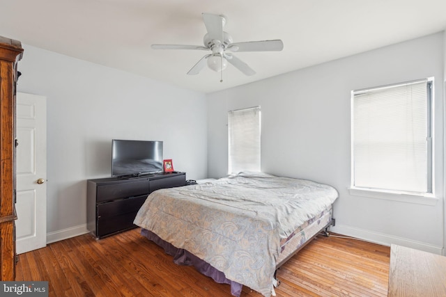 766 S 18th St, Philadelphia, PA 19146 - bedroom featuring baseboards, wood finished floors, and multiple windows