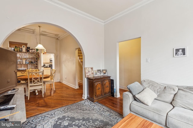 766 S 18th St, Philadelphia, PA 19146 - living area with arched walkways, wood finished floors, crown molding, and baseboards