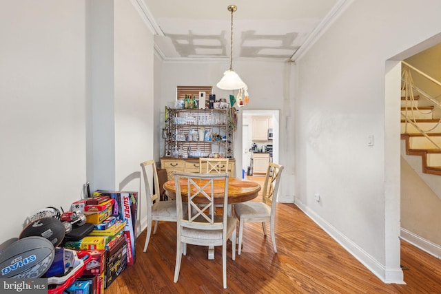 766 S 18th St, Philadelphia, PA 19146 - dining area with stairs, light wood-type flooring, crown molding, and baseboards