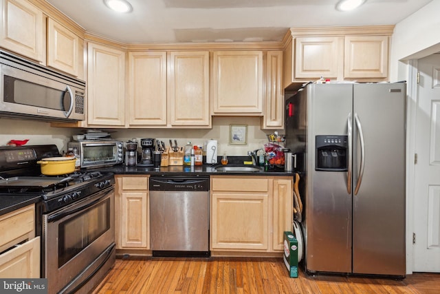 766 S 18th St, Philadelphia, PA 19146 - kitchen featuring stainless steel appliances, a sink, light brown cabinetry, and recessed lighting