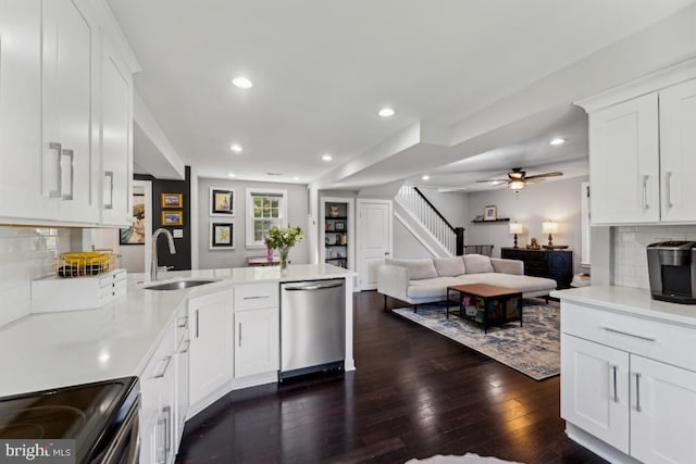 927 Annapolis Rd, Gambrills, MD 21054 - kitchen with appliances with stainless steel finishes, a sink, a peninsula, recessed lighting, and white cabinets