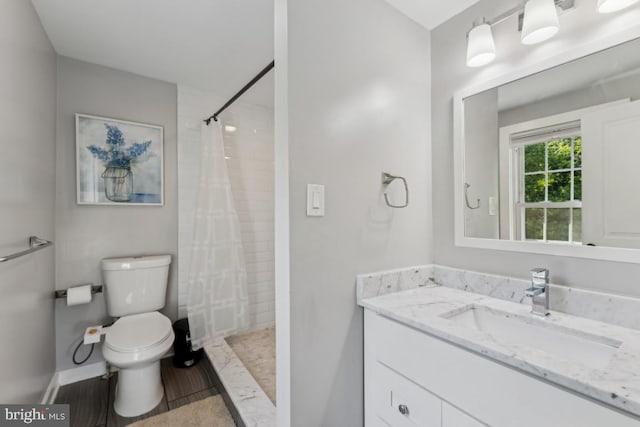 927 Annapolis Rd, Gambrills, MD 21054 - full bathroom featuring toilet, vanity, a tile shower, and baseboards