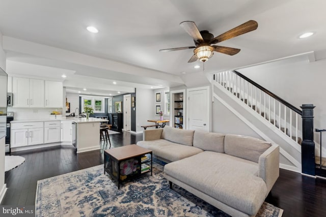 927 Annapolis Rd, Gambrills, MD 21054 - living room with stairway, dark wood-style floors, a ceiling fan, recessed lighting, and baseboards