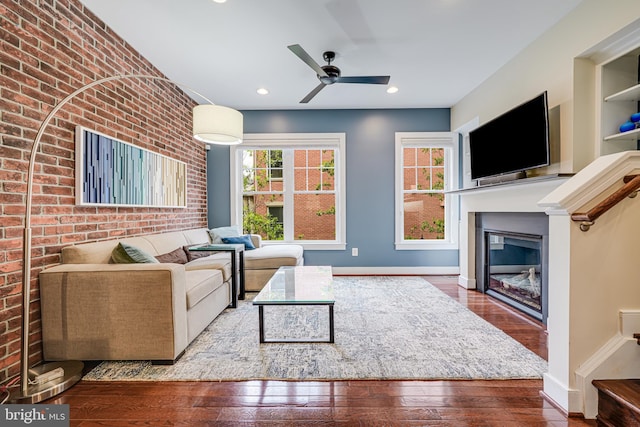 585 Regent Pl NE, Washington, DC 20017 - living room with a glass covered fireplace, hardwood / wood-style flooring, ceiling fan, baseboards, and recessed lighting