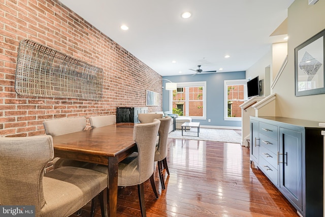 585 Regent Pl NE, Washington, DC 20017 - dining room with brick wall, wood-type flooring, ceiling fan, recessed lighting, and baseboards