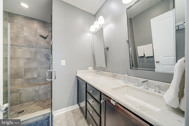 585 Regent Pl NE, Washington, DC 20017 - full bathroom featuring tile patterned flooring, double vanity, a shower stall, baseboards, and recessed lighting