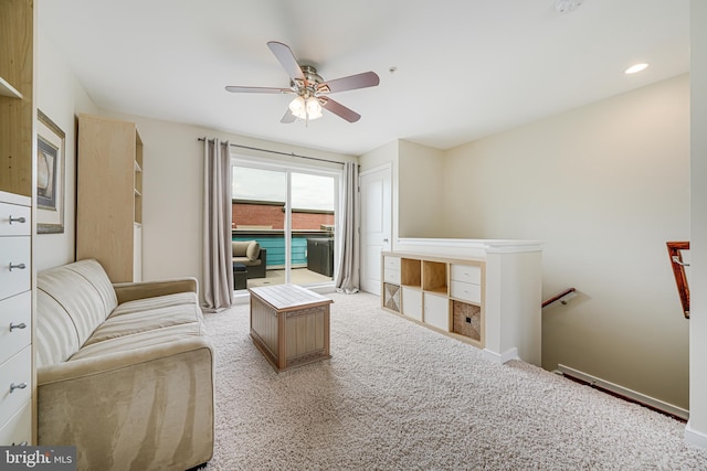585 Regent Pl NE, Washington, DC 20017 - living area featuring a ceiling fan, light colored carpet, and baseboards