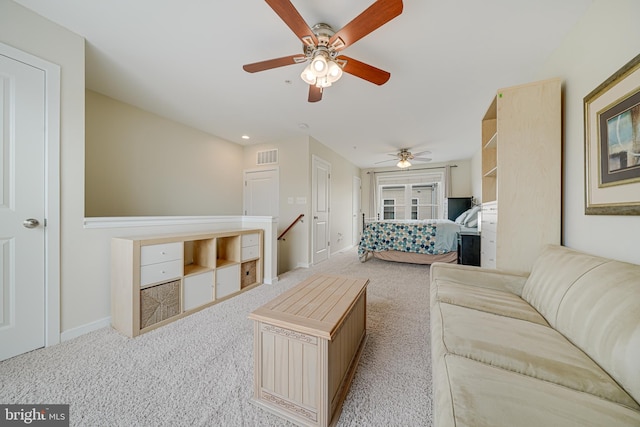 585 Regent Pl NE, Washington, DC 20017 - living area with ceiling fan, carpet floors, and baseboards