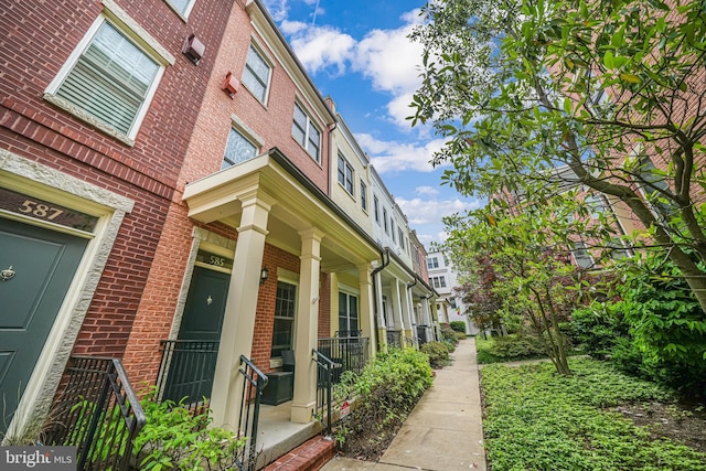 585 Regent Pl NE, Washington, DC 20017 - view of side of home with brick siding and covered porch