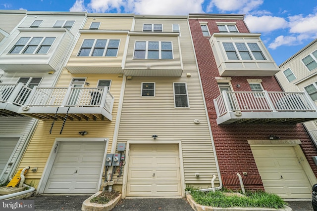 585 Regent Pl NE, Washington, DC 20017 - view of property featuring an attached garage and driveway
