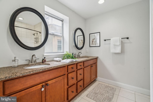 314 Monroe St, Philadelphia, PA 19147 - bathroom featuring double vanity, baseboards, tile patterned flooring, and a tile shower