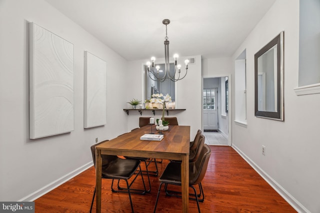 314 Monroe St, Philadelphia, PA 19147 - dining room with a chandelier, baseboards, and wood finished floors