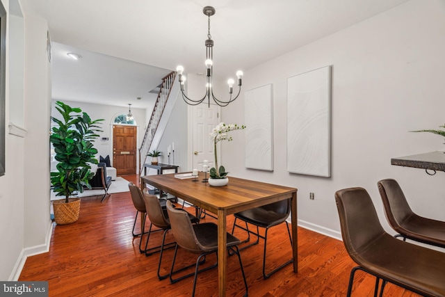 314 Monroe St, Philadelphia, PA 19147 - dining space featuring wood finished floors, baseboards, a chandelier, and stairs