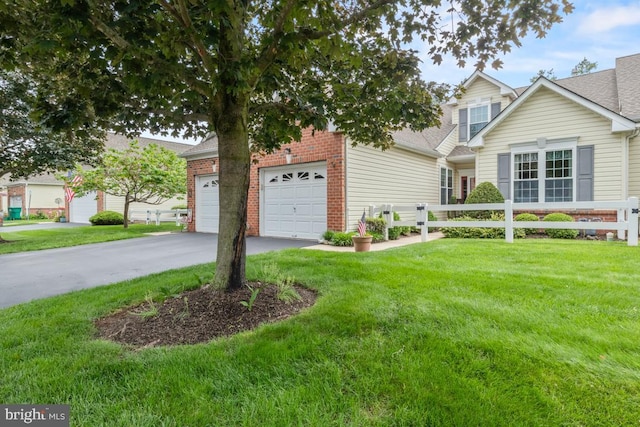 142 Wyndham Woods Way, Hatfield, PA 19440 - obstructed view of property with a garage, a front lawn, driveway, and brick siding