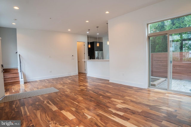 740 S Chris Columbus Blvd Unit 15, Philadelphia, PA 19147 - unfurnished living room featuring wood finished floors, stairway, and recessed lighting