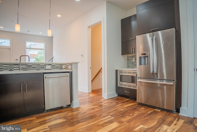 740 S Chris Columbus Blvd Unit 15, Philadelphia, PA 19147 - kitchen with appliances with stainless steel finishes, light wood-style floors, light countertops, tasteful backsplash, and recessed lighting