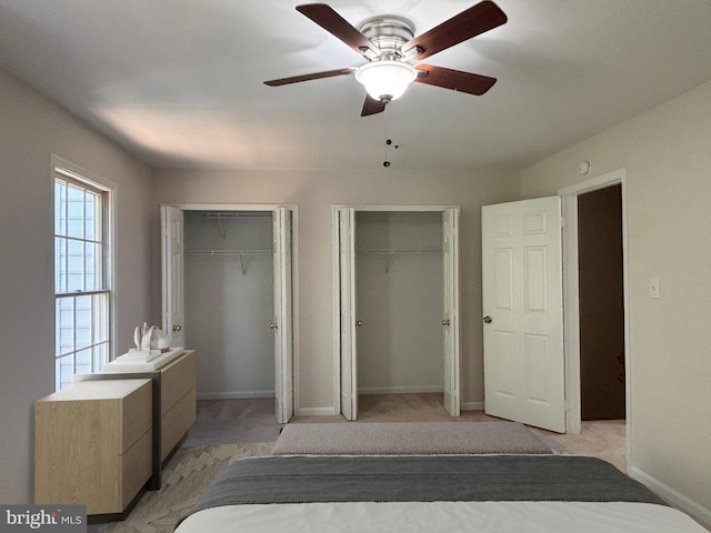 7930 Blue Gray Cir, Manassas, VA 20109 - bedroom with two closets, light carpet, and a ceiling fan