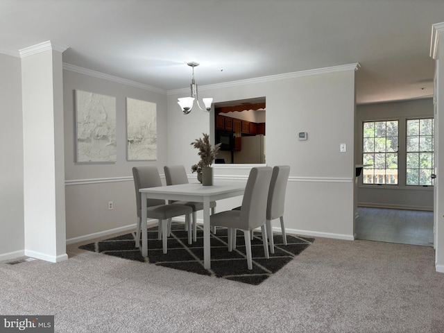 7930 Blue Gray Cir, Manassas, VA 20109 - dining space featuring a chandelier, carpet flooring, and ornamental molding