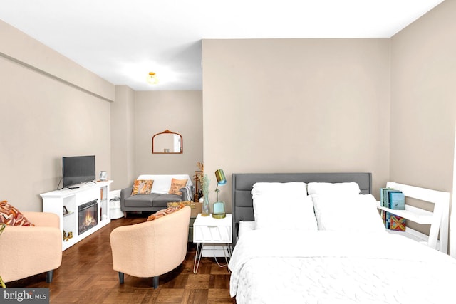 1725 New Hampshire Ave NW Unit 303, Washington, DC 20009 - bedroom featuring a glass covered fireplace