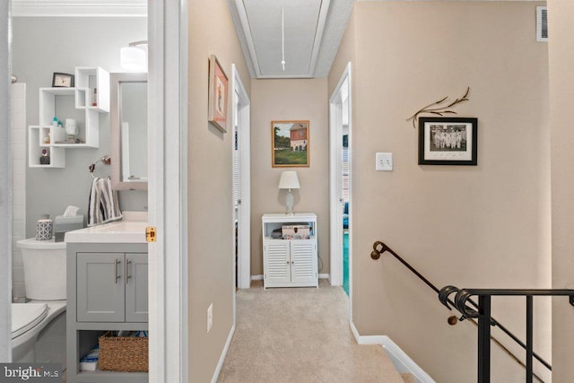 410 Kosoak Rd, Baltimore, MD 21220 - corridor with attic access, an upstairs landing, and light colored carpet