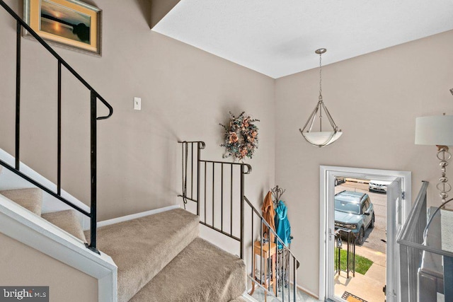 410 Kosoak Rd, Baltimore, MD 21220 - stairway with carpet floors and baseboards