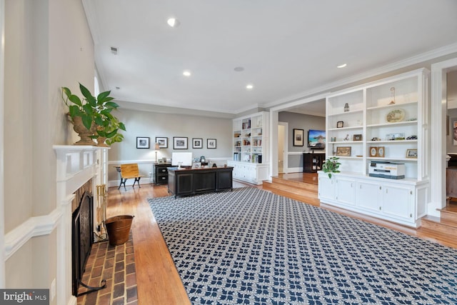 1225 Stuart Robeson Dr, Mclean, VA 22101 - living room with a fireplace, crown molding, light wood-style floors, built in features, and recessed lighting
