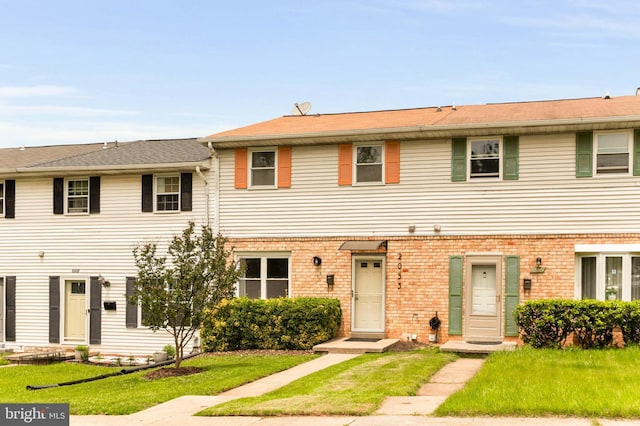 2053 Wintergreen Pl, Rosedale, MD 21237 - townhome / multi-family property featuring a front yard and brick siding