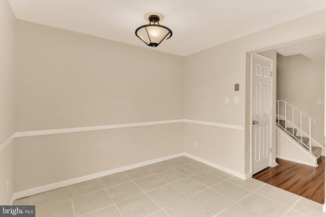 2053 Wintergreen Pl, Rosedale, MD 21237 - spare room with tile patterned flooring, baseboards, and stairs