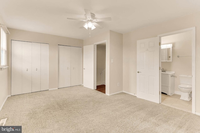 2053 Wintergreen Pl, Rosedale, MD 21237 - unfurnished bedroom with carpet flooring, two closets, ensuite bath, and baseboards