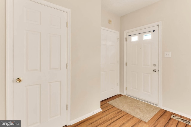 2053 Wintergreen Pl, Rosedale, MD 21237 - entrance foyer with light wood finished floors and baseboards