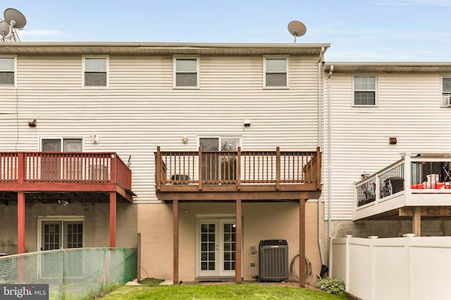 2053 Wintergreen Pl, Rosedale, MD 21237 - back of property featuring central AC, french doors, and a wooden deck